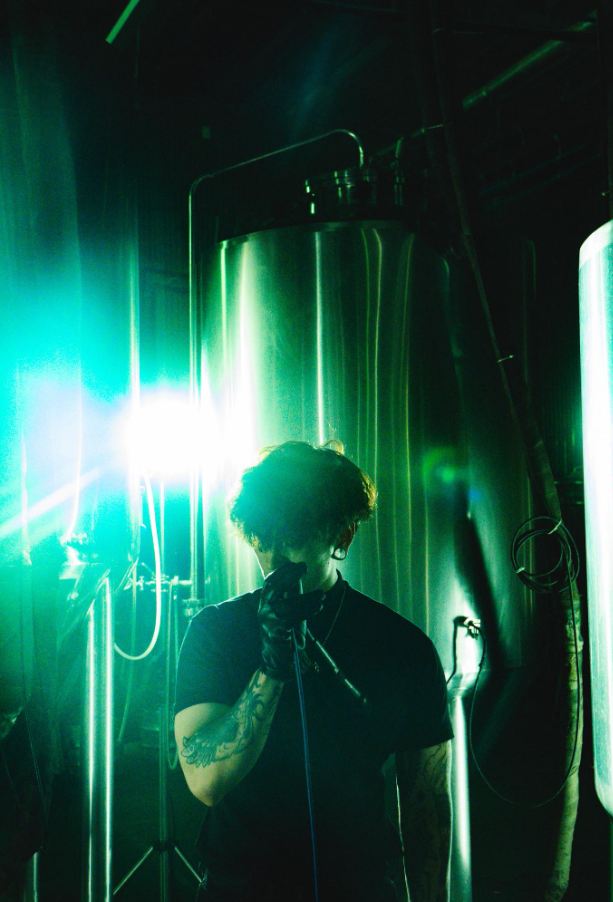 Vocalist silhouette with green backlighting
